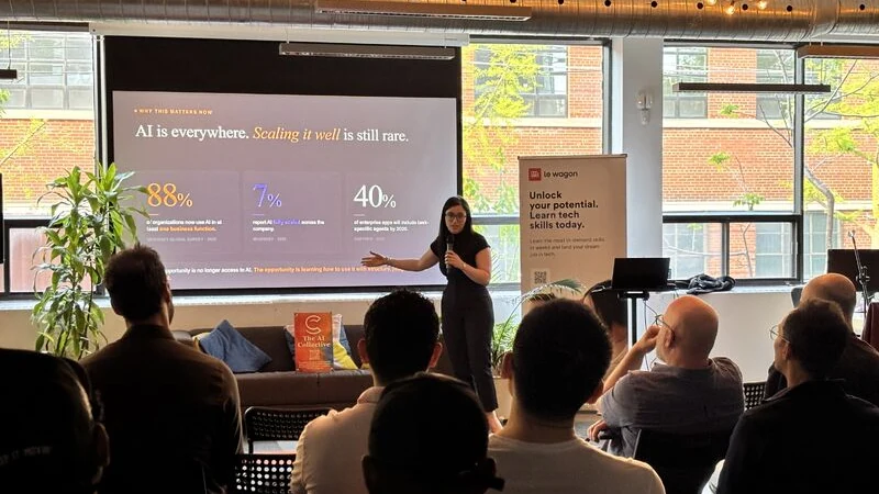 Sarra Kallel speaking to a full audience at The AI Collective event at Le Wagon Montréal
